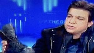 Pakistan minister Faisal Vawda with the boot on the talk show(YouTube) Pakistan minister Faisal Vawda with the boot on the talk show(YouTube)