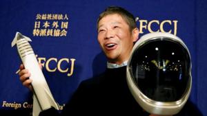 Japanese billionaire Yusaku Maezawa, who has been chosen as the first private passenger by SpaceX, poses for photos as he attends a news conference at the Foreign Correspondents' Club of Japan in Tokyo, Japan. Japanese billionaire Yusaku Maezawa, who has been chosen as the first private passenger by SpaceX, poses for photos as he attends a news conference at the Foreign Correspondents' Club of Japan in Tokyo, Japan.