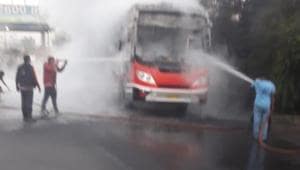 Fire brigade officers dousing the luxury bus which got gutted after a rear tyre caught fire, Jan 17, 2020.(HT Photo) Fire brigade officers dousing the luxury bus which got gutted after a rear tyre caught fire, Jan 17, 2020.(HT Photo)