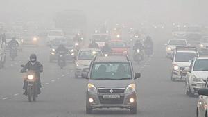 Vehicles move amid heavy fog on the Delhi-Gurugram Expressway, in Gurugram on December 30. Vehicles move amid heavy fog on the Delhi-Gurugram Expressway, in Gurugram on December 30.