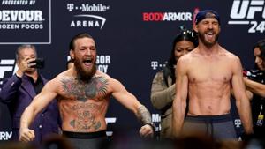 Conor McGregor and Donald Cerrone during the weigh-in.(REUTERS) Conor McGregor and Donald Cerrone during the weigh-in.(REUTERS)