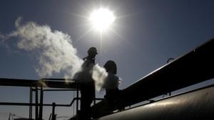 File photo of a Libyan oil worker.(AP Photo) File photo of a Libyan oil worker.(AP Photo)