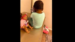 Images which show the angry girl sitting with her back towards the doll.(Twitter/@OohLala) Images which show the angry girl sitting with her back towards the doll.(Twitter/@OohLala)