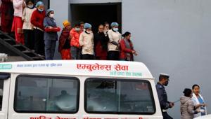 Hospital staff observe as the bodies of eight Indian tourists who died due to suspected suffocation are carried inside an ambulance while being taken for postmortem in Kathmandu, Nepal January 21, 2020.(Reuters) Hospital staff observe as the bodies of eight Indian tourists who died due to suspected suffocation are carried inside an ambulance while being taken for postmortem in Kathmandu, Nepal January 21, 2020.(Reuters)