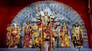 A priest offers Maha Ashtami “Sandhi Puja” at a Puja pandal during the ongoing Durga Puja festival.(PTI) A priest offers Maha Ashtami “Sandhi Puja” at a Puja pandal during the ongoing Durga Puja festival.(PTI)