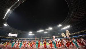Dancers perform at the opening ceremony of the New National Stadium, the main venue for the Tokyo 2020 Olympic and Paralympic Games.(AP) Dancers perform at the opening ceremony of the New National Stadium, the main venue for the Tokyo 2020 Olympic and Paralympic Games.(AP)