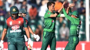Pakistan's Shaheen Afridi (2R) celebrates with captain Babar Azam (R) after taking a wicket.(AFP) Pakistan's Shaheen Afridi (2R) celebrates with captain Babar Azam (R) after taking a wicket.(AFP)