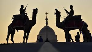 Border Security Force (BSF) personnel are silhouetted as they mount on camels during rehearsals for the Beating Retreat ceremony ahead of the Republic Day parade, at Raisina Hills, in New Delhi.(Sanjeev Verma/HT PHOTO) Border Security Force (BSF) personnel are silhouetted as they mount on camels during rehearsals for the Beating Retreat ceremony ahead of the Republic Day parade, at Raisina Hills, in New Delhi.(Sanjeev Verma/HT PHOTO)