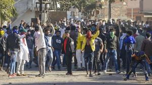 Jabalpur: A protestor hurls stones during an alleged confrontation between two communities during a pro-CAA protest in Jabalpur, Sunday, Jan. 26, 2020. (PTI Photo)(PTI1_26_2020_000373A)(PTI) Jabalpur: A protestor hurls stones during an alleged confrontation between two communities during a pro-CAA protest in Jabalpur, Sunday, Jan. 26, 2020. (PTI Photo)(PTI1_26_2020_000373A)(PTI)