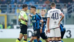 Inter Milan's Lautaro Martinez argues with referee Gianluca Manganiello after being sent off.(REUTERS)