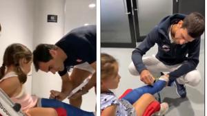 Roger Federer and Novak Djokovic sign the cast of a young girl.(ATP Tour/Screengrab) Roger Federer and Novak Djokovic sign the cast of a young girl.(ATP Tour/Screengrab)