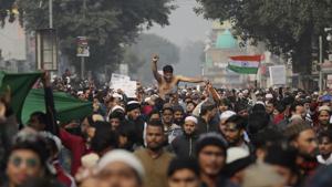 Indians march through a street during a protest against the Citizenship Amendment Act after Friday prayers in New Delhi.(Photo: AP) Indians march through a street during a protest against the Citizenship Amendment Act after Friday prayers in New Delhi.(Photo: AP)