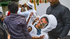 A party worker carries a bundle of Delhi Chief Minister Arvind Kejriwal's cut-outs ahead of the Delhi Assembly election at the party office, in New Delhi.(Photo: PTI) A party worker carries a bundle of Delhi Chief Minister Arvind Kejriwal's cut-outs ahead of the Delhi Assembly election at the party office, in New Delhi.(Photo: PTI)