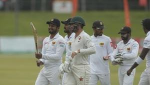 Sri Lanka and Zimbabwe players share a light moment as they walk off the pitch during their test match at Harare Sports Club.(AP) Sri Lanka and Zimbabwe players share a light moment as they walk off the pitch during their test match at Harare Sports Club.(AP)