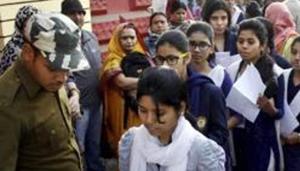 Patna: Police check students before entering the examination hall for Class 12 (intermediate) examinations of the Bihar School Examination Board (BSEB) in Patna(PTI)