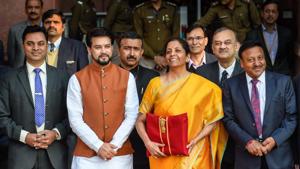 Union Finance Minister Nirmala Sitharaman, holding a folder containing the Union Budget documents, poses for photographers along with her deputy Anurag Thakur, outside the Ministry of Finance on Saturday.(PTI Photo) Union Finance Minister Nirmala Sitharaman, holding a folder containing the Union Budget documents, poses for photographers along with her deputy Anurag Thakur, outside the Ministry of Finance on Saturday.(PTI Photo)