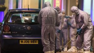 Police forensic officers work near a car at the scene after a stabbing incident in Streatham London, England(AP)