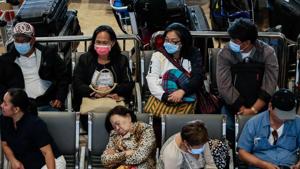 Passengers wait at the departure area while wearing protective masks, following confirmed cases of coronavirus in the country, at Ninoy Aquino International Airport, in Manila.(REUTERS) Passengers wait at the departure area while wearing protective masks, following confirmed cases of coronavirus in the country, at Ninoy Aquino International Airport, in Manila.(REUTERS)