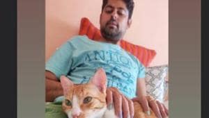 Varun Grover poses with his cat. Varun Grover poses with his cat.