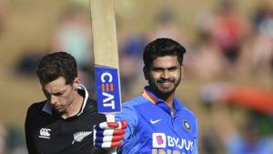 India's Shreyas Iyer celebrates his century - 100 not out as New Zealand's Mitchell Santner looks on.(AP) India's Shreyas Iyer celebrates his century - 100 not out as New Zealand's Mitchell Santner looks on.(AP)