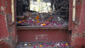 Flower petals scattered by the relatives of Godhra riots victims pictured at the doorsteps of a train carriage, that was set on fire in 2002, during the commemoration of the 12th anniversary of Godhra riots at Godhra.(File photo: Reuters) Flower petals scattered by the relatives of Godhra riots victims pictured at the doorsteps of a train carriage, that was set on fire in 2002, during the commemoration of the 12th anniversary of Godhra riots at Godhra.(File photo: Reuters)