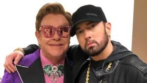 Eminem poses with Elton John at the Oscars. Eminem poses with Elton John at the Oscars.