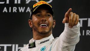 Mercedes' Lewis Hamilton celebrates with a trophy after winning the race.(REUTERS) Mercedes' Lewis Hamilton celebrates with a trophy after winning the race.(REUTERS)