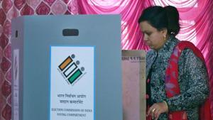 A woman casts her vote during the Delhi Assembly election at Narela in New Delhi, India, on Saturday, February 8, 2020.(Sanchit Khanna/HT PHOTO) A woman casts her vote during the Delhi Assembly election at Narela in New Delhi, India, on Saturday, February 8, 2020.(Sanchit Khanna/HT PHOTO)