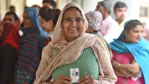 A woman shows her voter id card before casting her vote during the Delhi Assembly election at Narela in New Delhi, India, on Saturday, February 8, 2020.(Sanchit Khanna/HT PHOTO) A woman shows her voter id card before casting her vote during the Delhi Assembly election at Narela in New Delhi, India, on Saturday, February 8, 2020.(Sanchit Khanna/HT PHOTO)