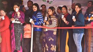 People show their voter id cards while standing in a queue to cast their votes during the Delhi Assembly election at Narela in New Delhi, India, on Saturday, February 8, 2020.(Sanchit Khanna/HT PHOTO) People show their voter id cards while standing in a queue to cast their votes during the Delhi Assembly election at Narela in New Delhi, India, on Saturday, February 8, 2020.(Sanchit Khanna/HT PHOTO)