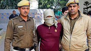 Police with suspect who shot dead an AAP supporter(HT photo) Police with suspect who shot dead an AAP supporter(HT photo)
