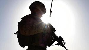 In this file photo, a US Marine watches Afghan Commandos take part in a combat training exercise at Shorab Military Camp in Lashkar Gah in Helmand province. In this file photo, a US Marine watches Afghan Commandos take part in a combat training exercise at Shorab Military Camp in Lashkar Gah in Helmand province.