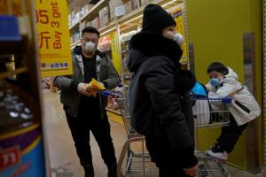 Customers wearing face masks shop inside a supermarket, as the country is hit by an outbreak of the novel coronavirus, in Beijing, China(REUTERS) Customers wearing face masks shop inside a supermarket, as the country is hit by an outbreak of the novel coronavirus, in Beijing, China(REUTERS)