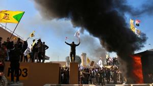 Protesters burn property in front of the U.S. embassy compound, in Baghdad, Iraq.(AP photo for representation) Protesters burn property in front of the U.S. embassy compound, in Baghdad, Iraq.(AP photo for representation)
