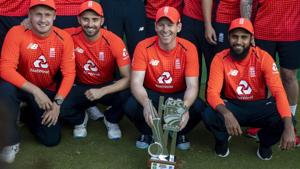 England's captain Eoin Morgan, second from right, with teammates pose for photographers after winning the T20 cricket series against South Africa at Centurion Park.(AP) England's captain Eoin Morgan, second from right, with teammates pose for photographers after winning the T20 cricket series against South Africa at Centurion Park.(AP)