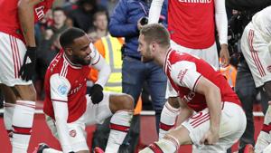 Arsenal's Alexandre Lacazette, left, celebrates with Shkodran Mustafi after scoring his side's fourth goal during the English Premier League soccer match between Arsenal and Newcastle at the Emirates Stadium in London, Sunday, Feb. 16, 2020.(AP Photo/Frank Augstein)(AP)