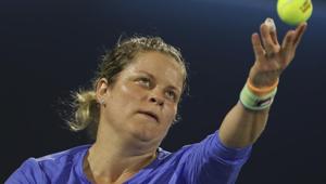Belgium's Kim Clijsters returns the ball to Spain's Gabrine Muguruza during a match at Dubai Duty Free Tennis Championship.(AP) Belgium's Kim Clijsters returns the ball to Spain's Gabrine Muguruza during a match at Dubai Duty Free Tennis Championship.(AP)