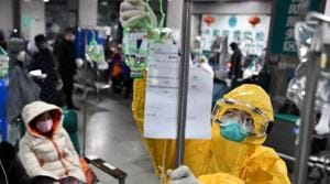A medical worker in protective suit adjusts a drip bag for a patient at a hospital, following an outbreak of the new coronavirus in Wuhan, Hubei province, China.(Reuters Photo) A medical worker in protective suit adjusts a drip bag for a patient at a hospital, following an outbreak of the new coronavirus in Wuhan, Hubei province, China.(Reuters Photo)