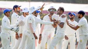 Karnataka bowler Mithun celebrates with his teammates(PTI) Karnataka bowler Mithun celebrates with his teammates(PTI)
