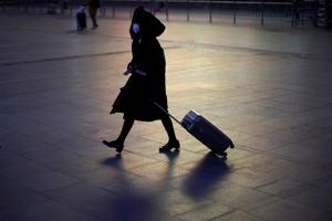 A woman wears a protective mask at the Shanghai railway station in Shanghai, China, due to the country's coronavirus outbreak, February 17, 2020.(Reuters File Photo) A woman wears a protective mask at the Shanghai railway station in Shanghai, China, due to the country's coronavirus outbreak, February 17, 2020.(Reuters File Photo)