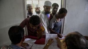 Villagers check for their names in the final NRC list in Buraburi village in Assam’s Morigaon district in this file photo.(AP) Villagers check for their names in the final NRC list in Buraburi village in Assam’s Morigaon district in this file photo.(AP)