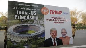 A hoarding welcoming U.S. President Donald Trump being carried for installing it on the route of his visit to Ahmedabad, Wednesday, Feb. 19, 2020.(AP) A hoarding welcoming U.S. President Donald Trump being carried for installing it on the route of his visit to Ahmedabad, Wednesday, Feb. 19, 2020.(AP)