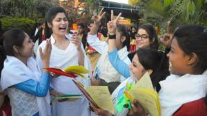 Students flash the victory sign after appearing in board exam(PTI) Students flash the victory sign after appearing in board exam(PTI)