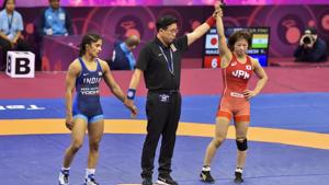 Japanese wrestler Mayu Mukaida (red) is declared winner against India's Vinesh Phogat after the women's 53kg quarterfinal bout during Asian Senior Wrestling Championship.(PTI) Japanese wrestler Mayu Mukaida (red) is declared winner against India's Vinesh Phogat after the women's 53kg quarterfinal bout during Asian Senior Wrestling Championship.(PTI)