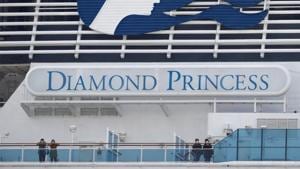 Masked passengers look on from on board the coronavirus-hit Diamond Princess cruise ship docked at Yokohama Port, south of Tokyo, Japan, on February 20, 2020.(Reuters Photo) Masked passengers look on from on board the coronavirus-hit Diamond Princess cruise ship docked at Yokohama Port, south of Tokyo, Japan, on February 20, 2020.(Reuters Photo)