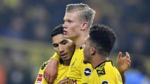 Dortmund's scorer Erling Haaland, center, celebrates his goal with teammates Jadon Sancho, right, and Achraf Hakimi, left, during the German Bundesliga soccer match between Borussia Dortmund and Eintracht Frankfurt.(AP) Dortmund's scorer Erling Haaland, center, celebrates his goal with teammates Jadon Sancho, right, and Achraf Hakimi, left, during the German Bundesliga soccer match between Borussia Dortmund and Eintracht Frankfurt.(AP)
