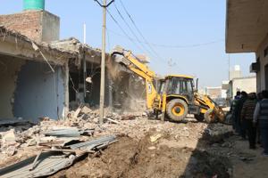 The district administration demolished 12 of the 83 illegal structures falling within the 100-metre radius of the boundary wall of the air force station in Bhabat village of Zirakpur on Thursday.(Sushil Prajapati/HT) The district administration demolished 12 of the 83 illegal structures falling within the 100-metre radius of the boundary wall of the air force station in Bhabat village of Zirakpur on Thursday.(Sushil Prajapati/HT)