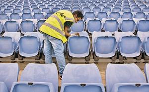 Mr Cleaner: Wiping seats at a stadium in Sydney, Australia.(Cameron Spencer/Getty Images) Mr Cleaner: Wiping seats at a stadium in Sydney, Australia.(Cameron Spencer/Getty Images)