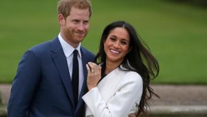 Britain's Prince Harry stands with his wifeMeghan Markle(AFP photo) Britain's Prince Harry stands with his wifeMeghan Markle(AFP photo)