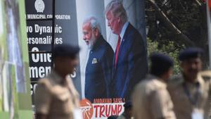 Policemen stand in front of a billboard displaying a picture of India's Prime Minister Narendra Modi and US President Donald Trump in Ahmedabad on February 23, 2020, ahead of Trump's arrival.(AFP) Policemen stand in front of a billboard displaying a picture of India's Prime Minister Narendra Modi and US President Donald Trump in Ahmedabad on February 23, 2020, ahead of Trump's arrival.(AFP)
